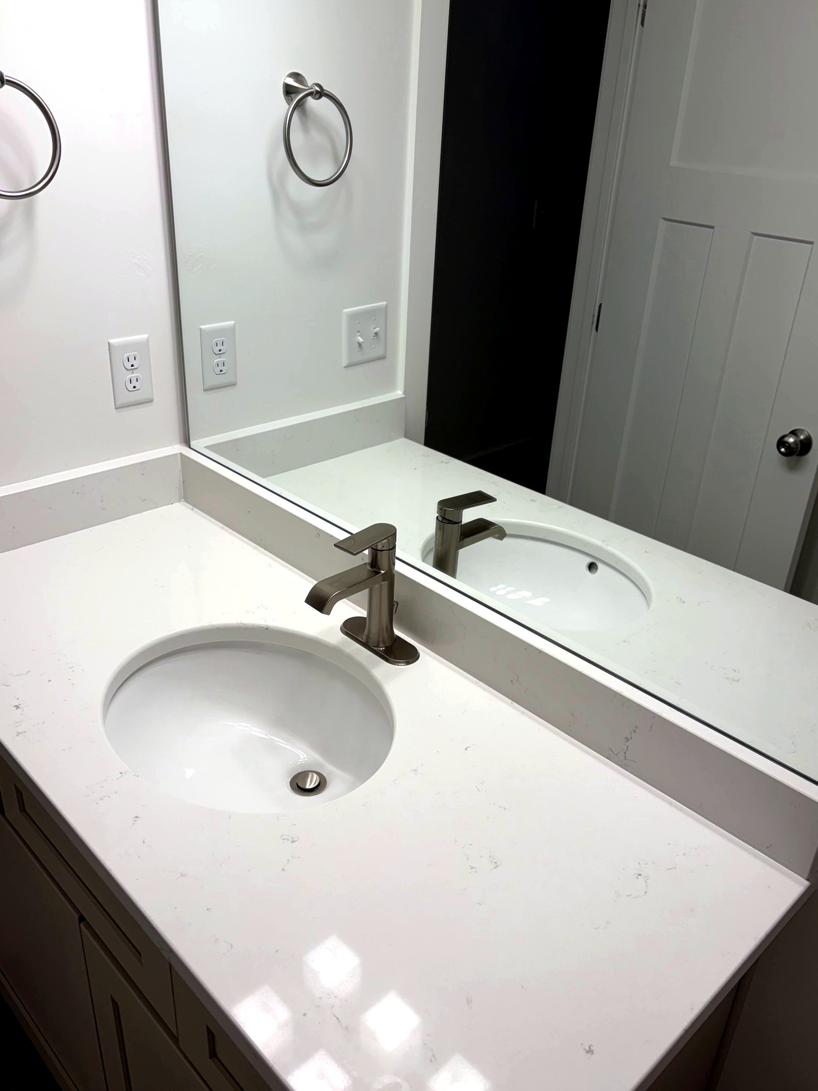 Bathroom sink and faucet cleaned to remove hard water deposits