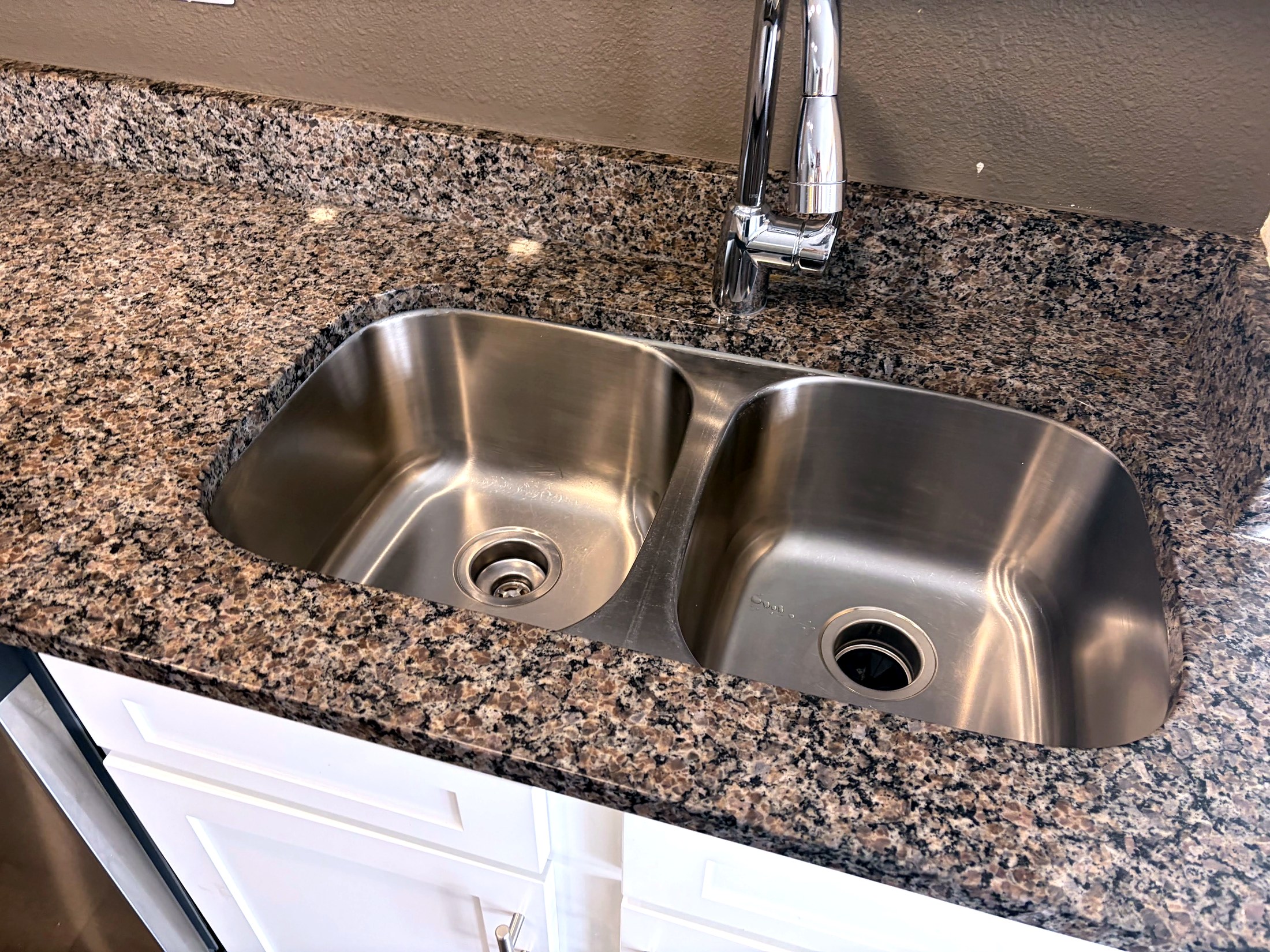 Stainless kitchen sink cleaned during a Jordanelle vacation rental turnover